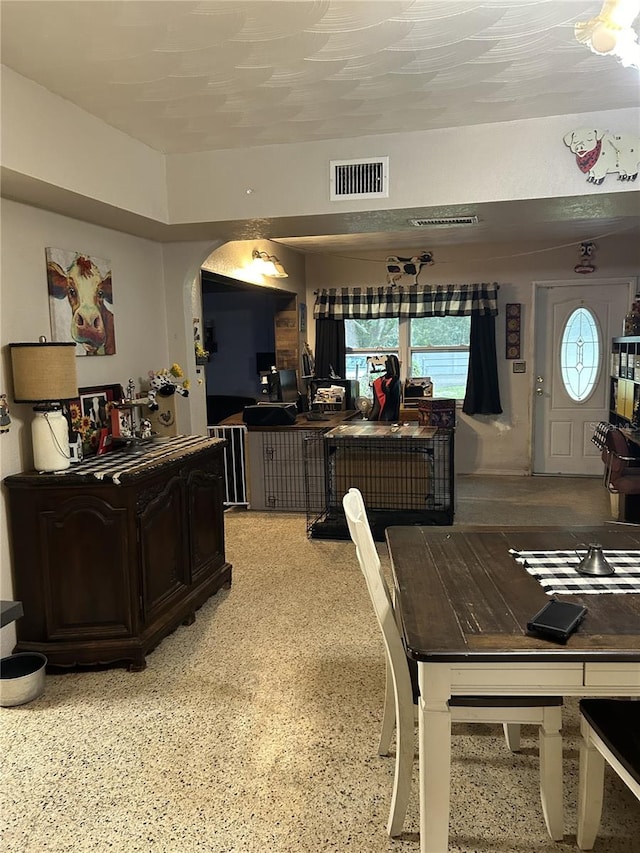 dining room featuring a textured ceiling