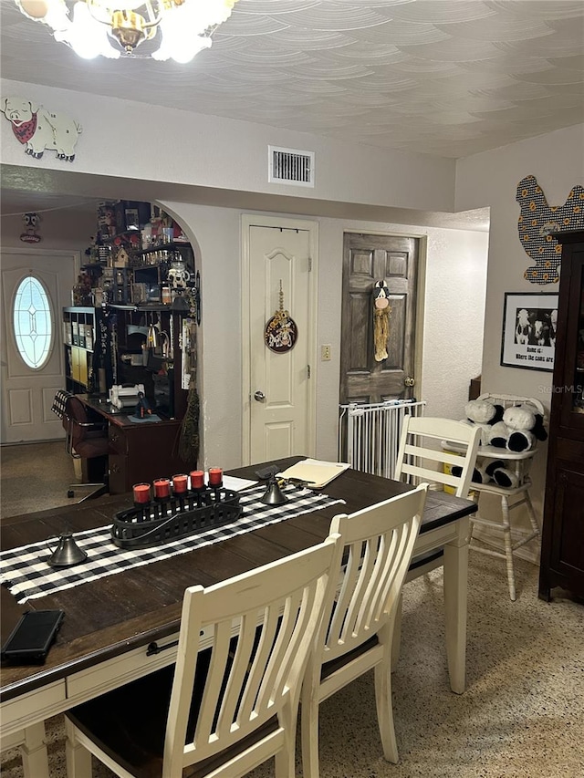 dining room with a chandelier