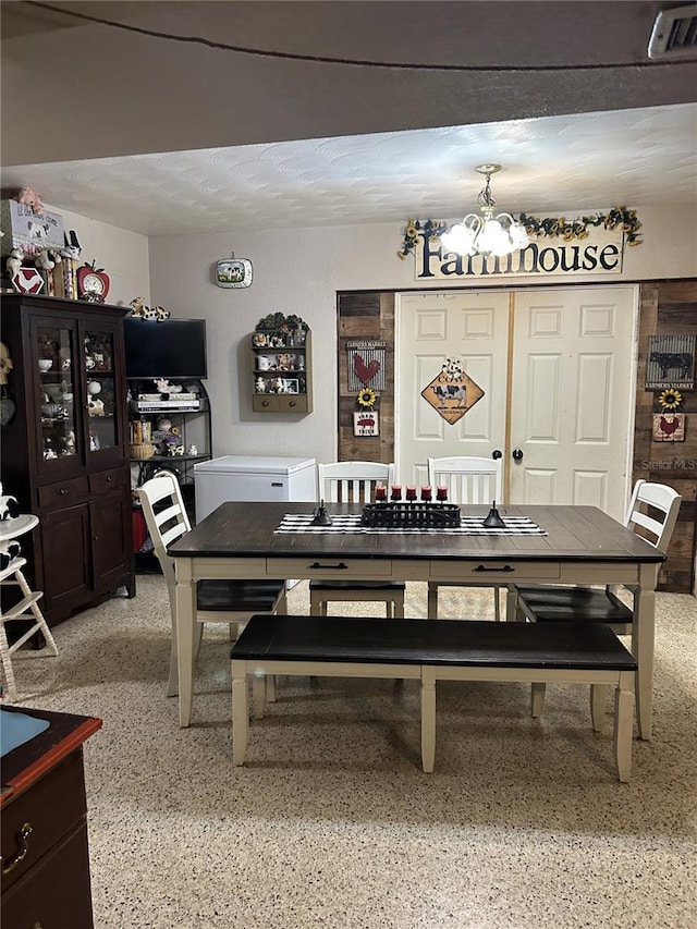 dining space featuring a chandelier