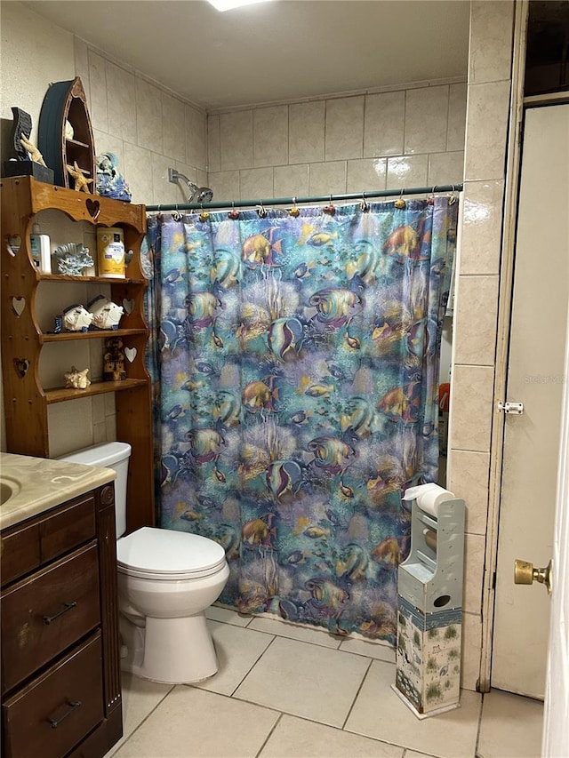 bathroom featuring vanity, toilet, and tile patterned floors