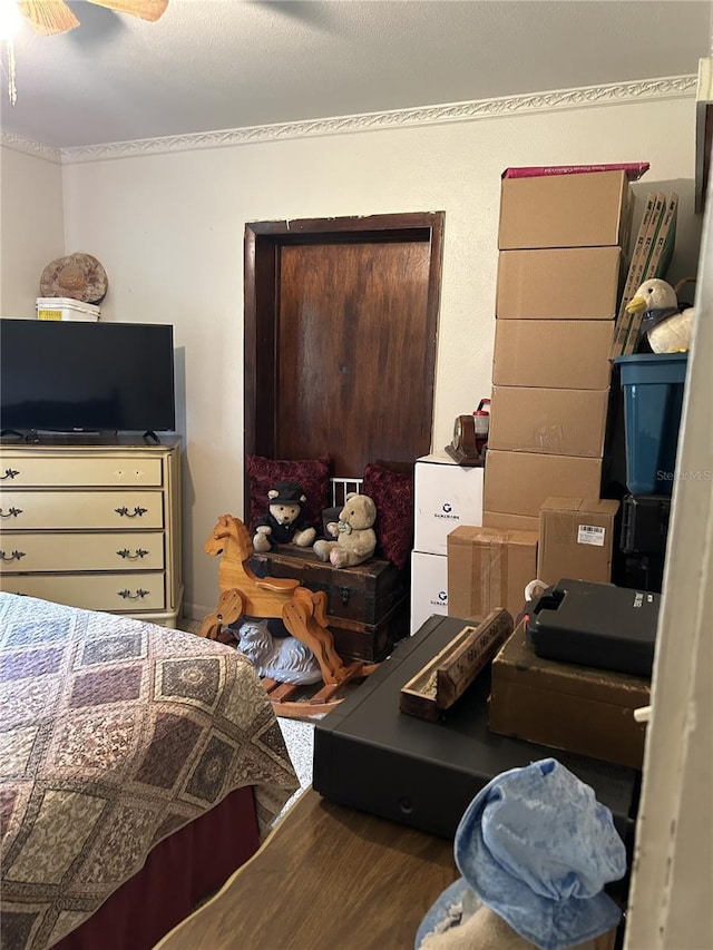 bedroom featuring wood-type flooring and ceiling fan