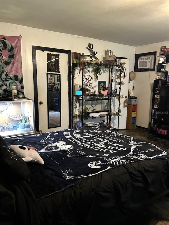 bedroom featuring a wall mounted AC and hardwood / wood-style floors