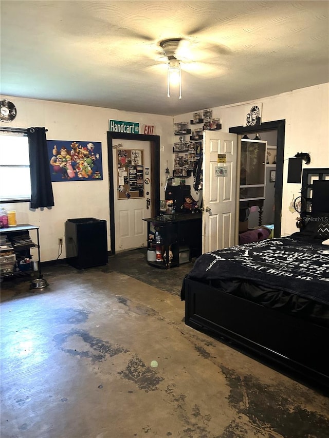 bedroom featuring concrete flooring and ceiling fan