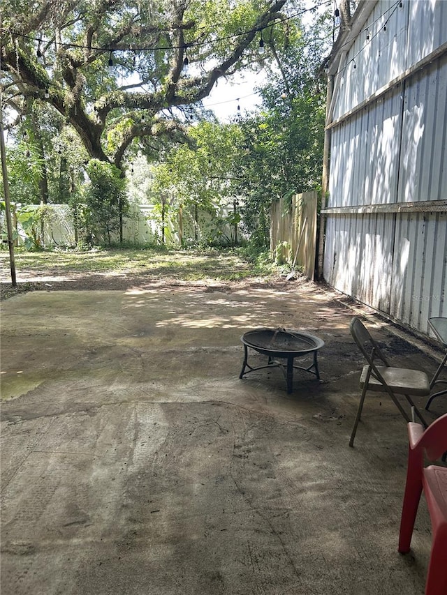 view of patio featuring an outdoor fire pit