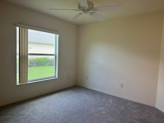 empty room featuring ceiling fan and carpet floors