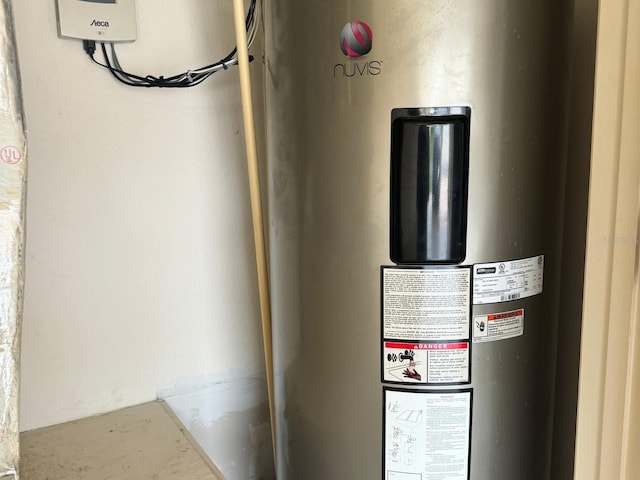 utility room featuring water heater