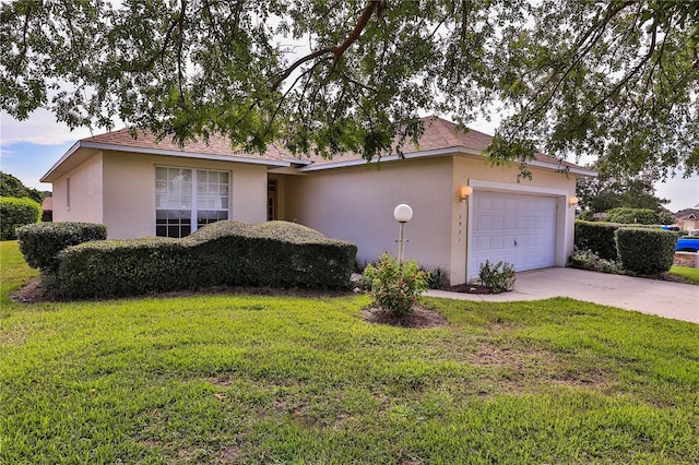 ranch-style house featuring a garage and a front yard