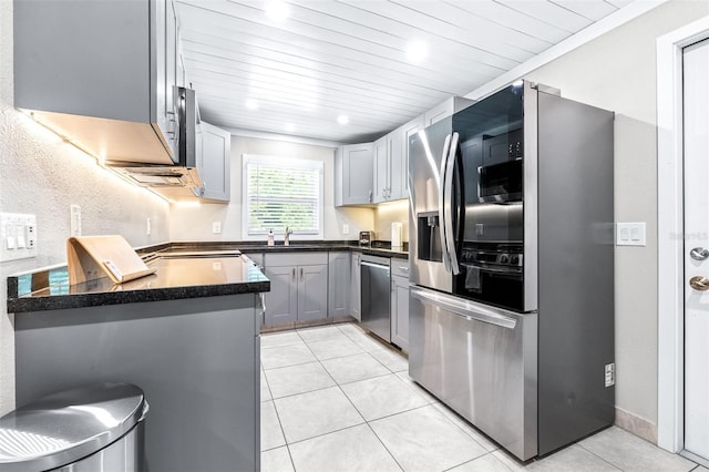 kitchen with light tile patterned floors, sink, appliances with stainless steel finishes, gray cabinetry, and wooden ceiling