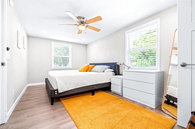 bedroom featuring ceiling fan and light wood-type flooring