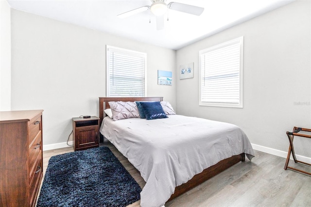 bedroom featuring light hardwood / wood-style floors and ceiling fan