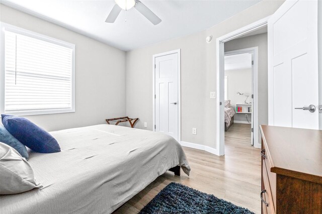 bedroom with ceiling fan and light hardwood / wood-style flooring