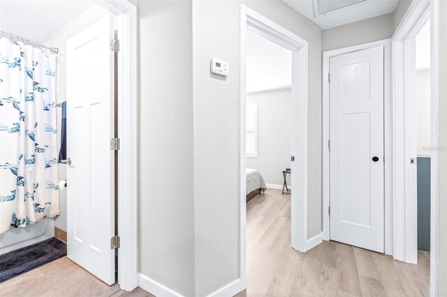 hall featuring light hardwood / wood-style flooring