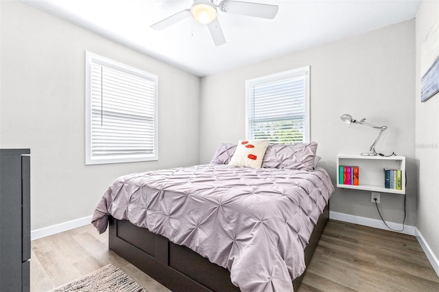 bedroom featuring hardwood / wood-style floors and ceiling fan