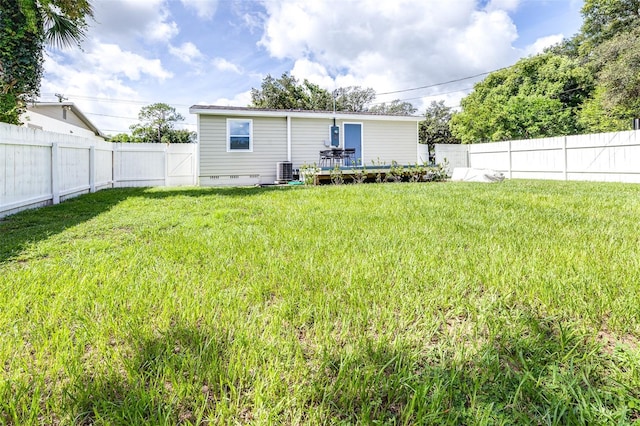 back of house with a lawn