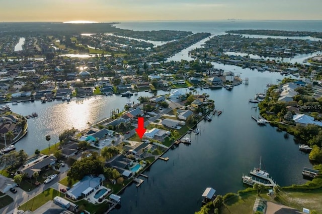 aerial view at dusk with a water view