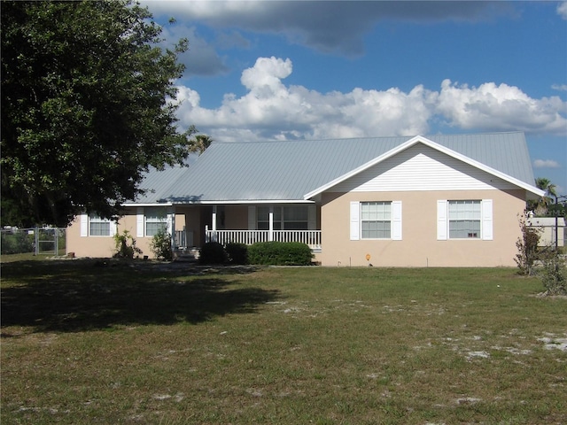 single story home with covered porch and a front lawn