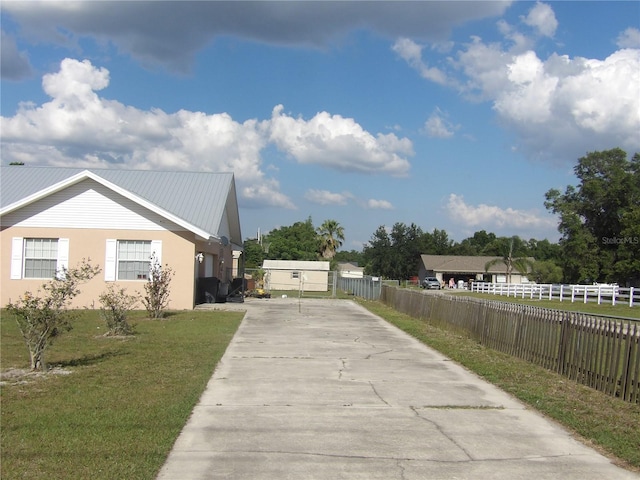 view of side of property with a yard