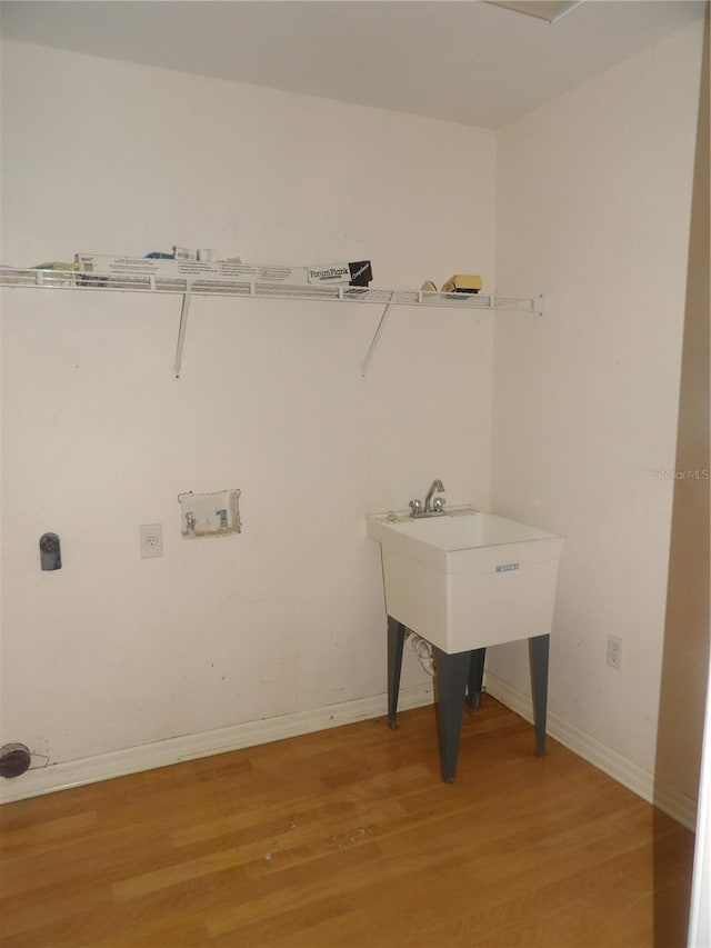 laundry area featuring wood-type flooring and hookup for a washing machine