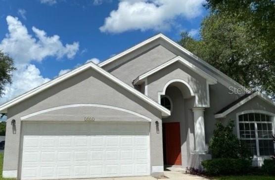 view of front of property with a garage