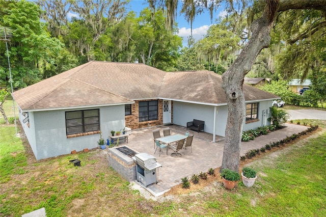 rear view of house with a patio area