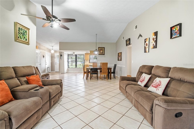 tiled living room featuring ceiling fan and lofted ceiling