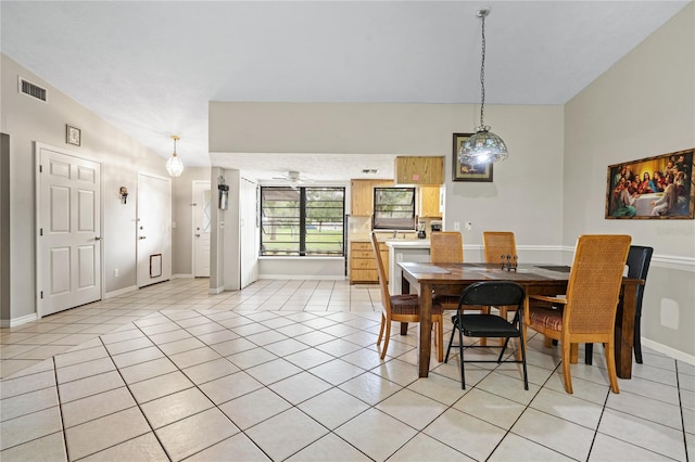 dining area with light tile patterned floors