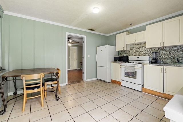 kitchen with ceiling fan, crown molding, light tile patterned floors, backsplash, and white appliances