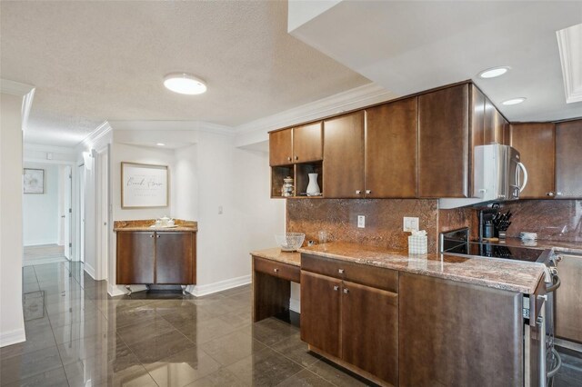 kitchen featuring dark tile patterned flooring, tasteful backsplash, range with electric cooktop, and crown molding