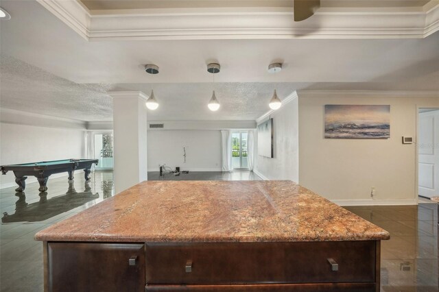 kitchen with pool table, crown molding, and dark tile patterned flooring