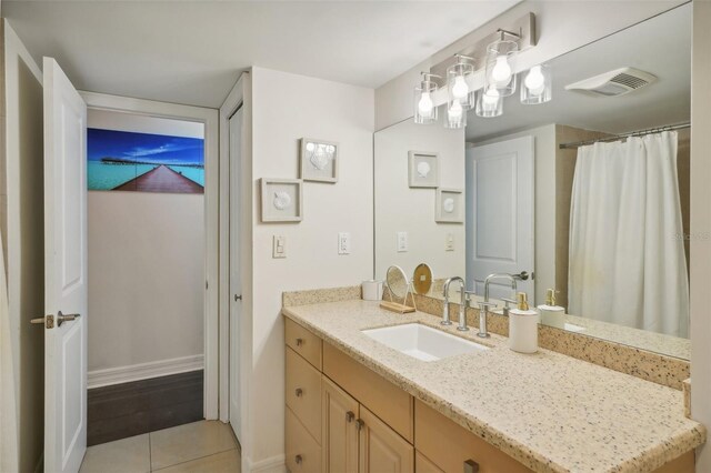 bathroom with vanity and tile patterned floors