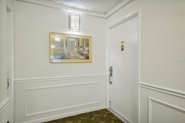 entryway featuring a textured ceiling