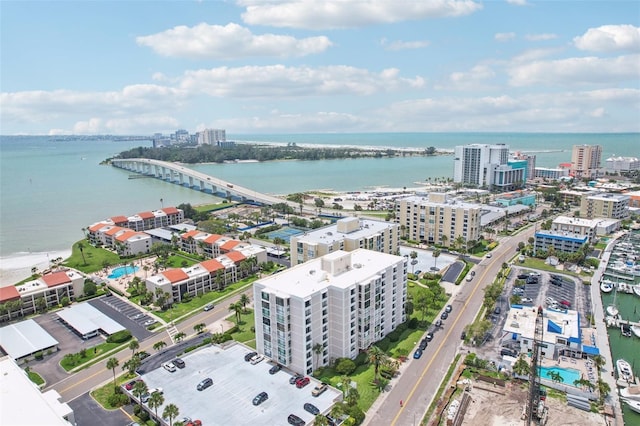 birds eye view of property featuring a water view and a view of city