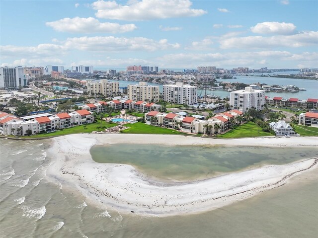 birds eye view of property with a water view and a view of the beach