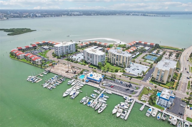 birds eye view of property with a water view and a view of city