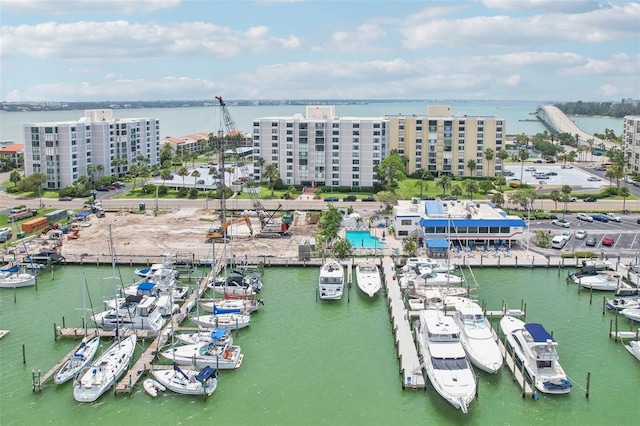 birds eye view of property featuring a water view and a city view