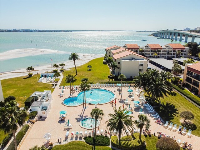 birds eye view of property with a water view