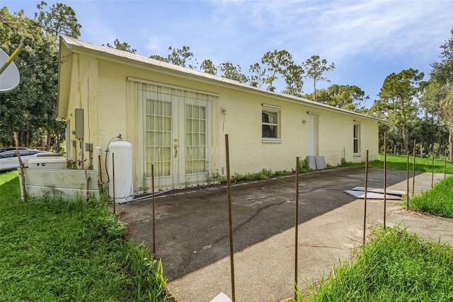 back of property featuring a patio