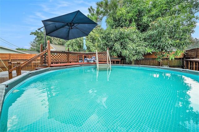 view of pool featuring a wooden deck