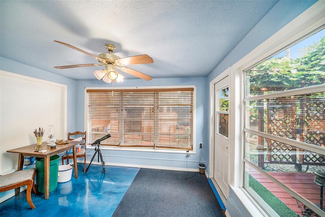 office area with ceiling fan, a textured ceiling, and carpet floors