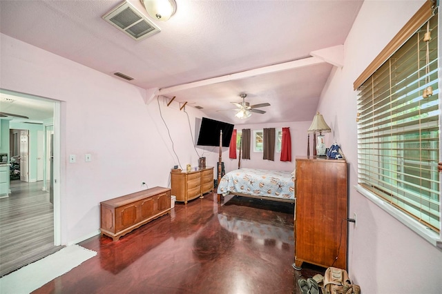 bedroom with ceiling fan and a textured ceiling