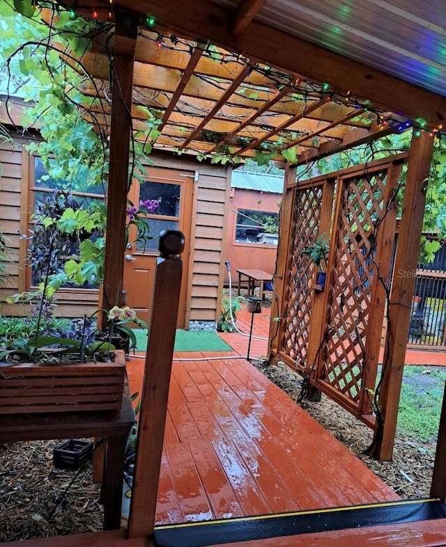 wooden terrace featuring a pergola