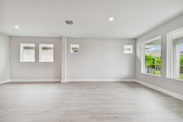 unfurnished room with light wood-type flooring