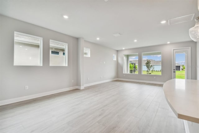 spare room featuring light wood-type flooring