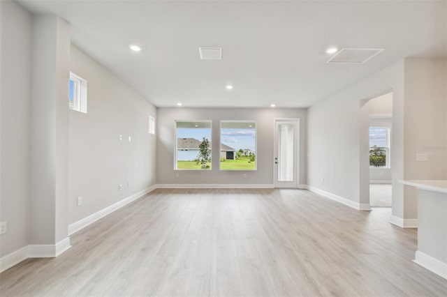 unfurnished living room with light wood-type flooring