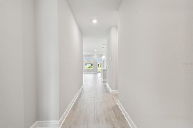 corridor featuring light wood-type flooring