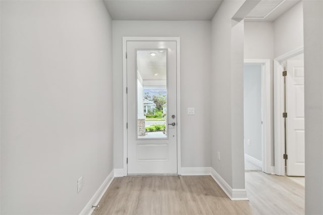 doorway to outside with light hardwood / wood-style flooring