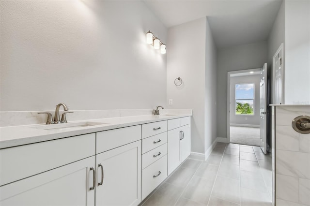 bathroom with tile patterned floors and vanity