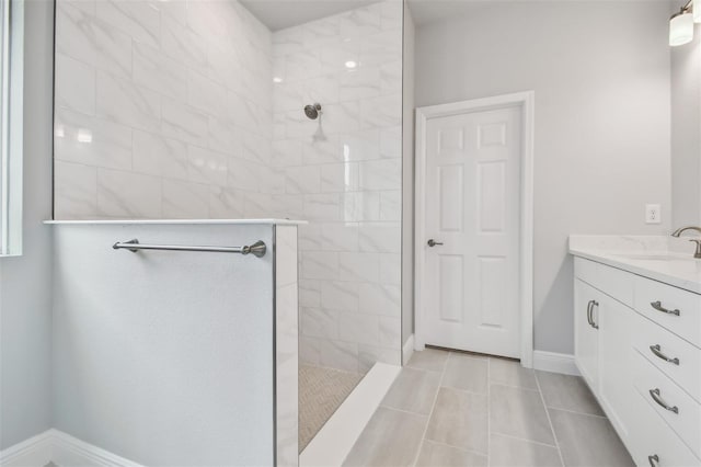 bathroom featuring vanity and a tile shower