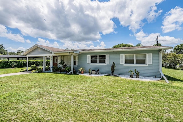 ranch-style home featuring a front yard