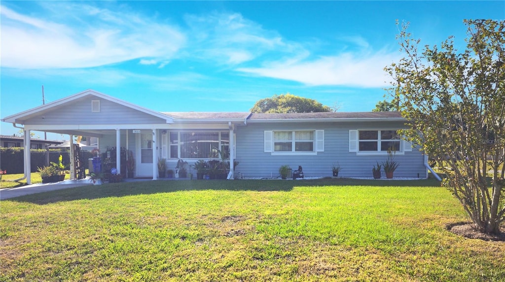 single story home with an attached carport and a front yard